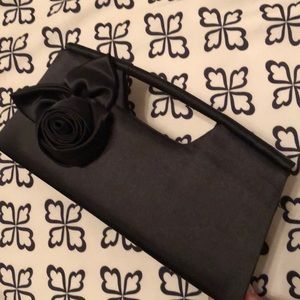Black clutch with statement rose NWOT